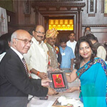 Dr. Nandita Palshetkar receiving 'Bharat Gaurav' award in the UK
